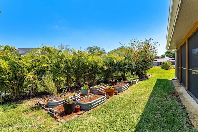 3210 Calgary St, Melbourne, FL 32935 - view of yard featuring a garden