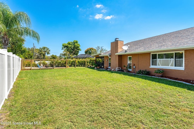3210 Calgary St, Melbourne, FL 32935 - view of yard featuring a fenced backyard