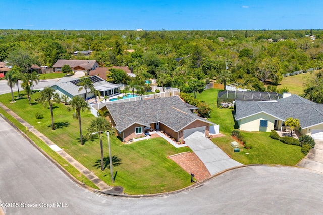 3210 Calgary St, Melbourne, FL 32935 - aerial view featuring a wooded view