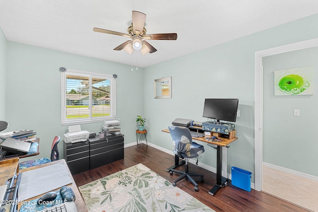 3210 Calgary St, Melbourne, FL 32935 - home office featuring baseboards, wood finished floors, and ceiling fan