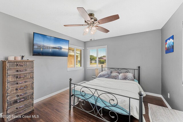 3210 Calgary St, Melbourne, FL 32935 - bedroom featuring baseboards, a ceiling fan, and wood finished floors