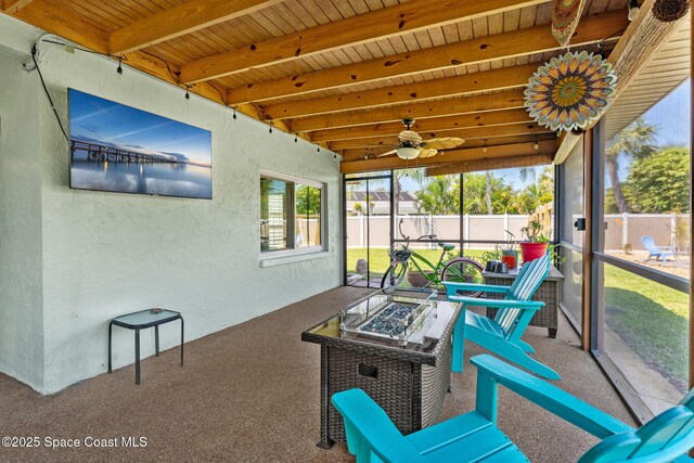 3210 Calgary St, Melbourne, FL 32935 - sunroom with an outdoor fire pit, a ceiling fan, and beamed ceiling