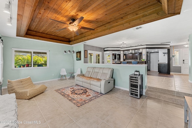 3210 Calgary St, Melbourne, FL 32935 - living room featuring visible vents, a raised ceiling, wood ceiling, tile patterned flooring, and beverage cooler