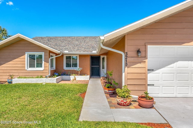 3210 Calgary St, Melbourne, FL 32935 - view of front of house featuring a front yard, a shingled roof, stucco siding, and an attached garage