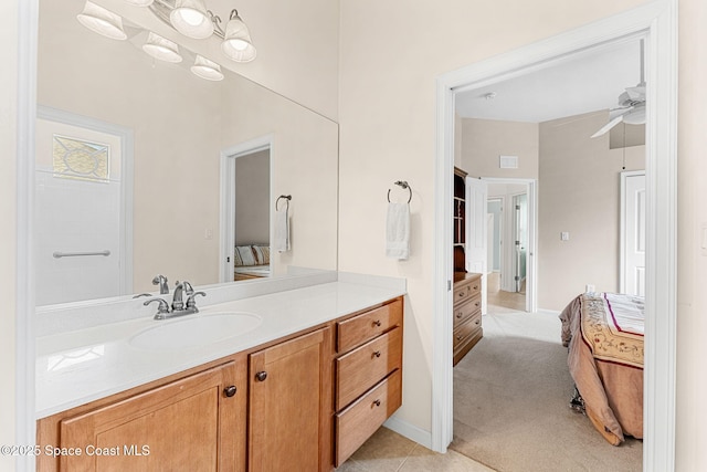 bathroom featuring a ceiling fan and vanity