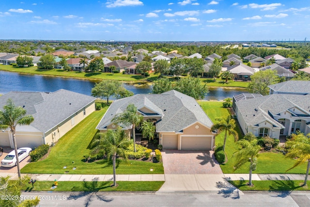 aerial view with a water view and a residential view