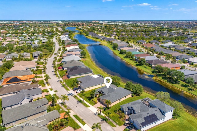 aerial view featuring a water view and a residential view