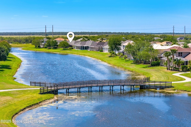 aerial view with a residential view and a water view