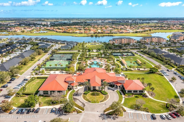 birds eye view of property with a water view