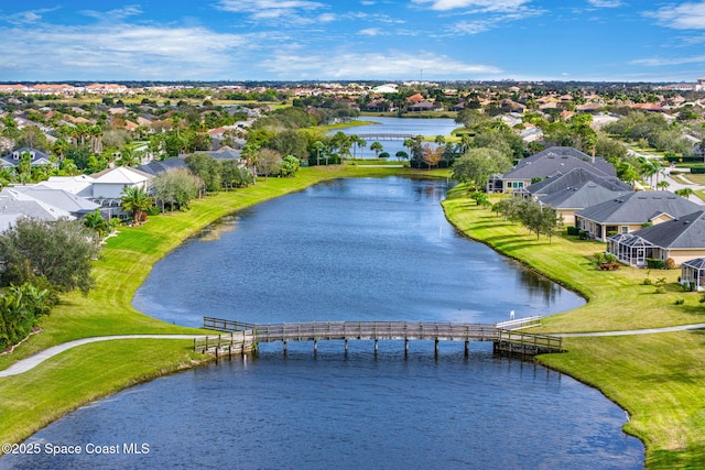 bird's eye view featuring a residential view and a water view