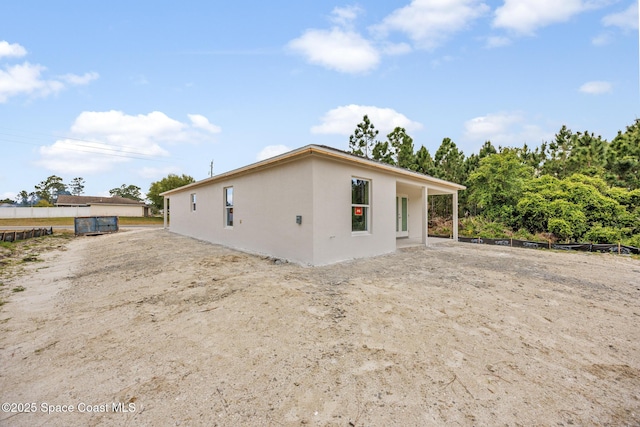exterior space featuring stucco siding