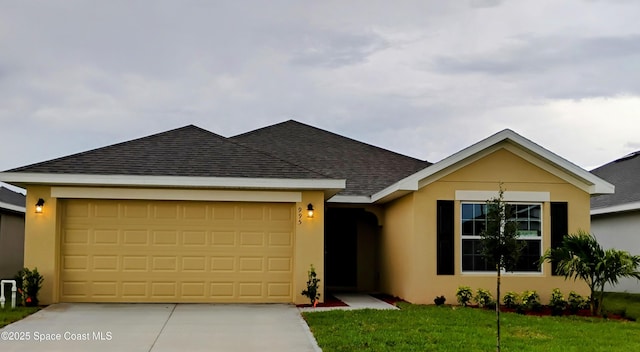995 Kylar Dr NW, Palm Bay, FL 32907 - view of front of home with stucco siding, concrete driveway, and a shingled roof