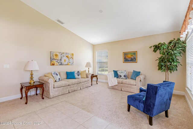 2842 Galindo Cir, Melbourne, FL 32940 - living room featuring light tile patterned floors, light carpet, baseboards, and visible vents