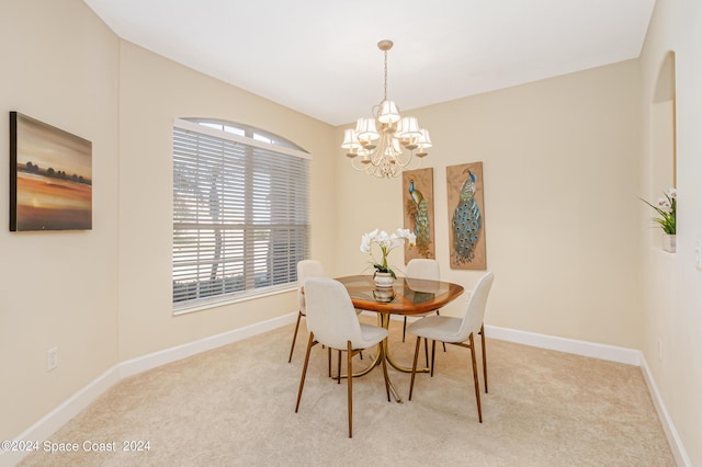 2842 Galindo Cir, Melbourne, FL 32940 - carpeted dining room featuring baseboards and a chandelier