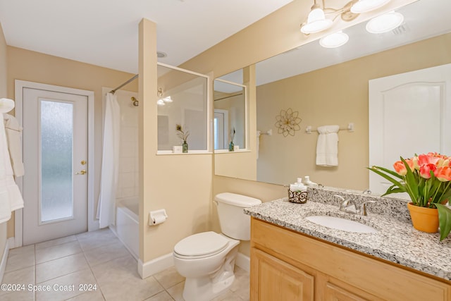 2842 Galindo Cir, Melbourne, FL 32940 - bathroom with baseboards, toilet, vanity, shower / tub combo, and tile patterned flooring