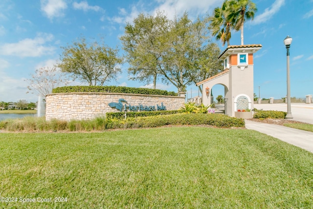 2842 Galindo Cir, Melbourne, FL 32940 - community sign featuring a water view and a yard