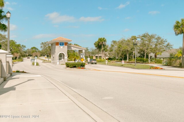 2842 Galindo Cir, Melbourne, FL 32940 - view of street featuring street lighting, traffic signs, and curbs