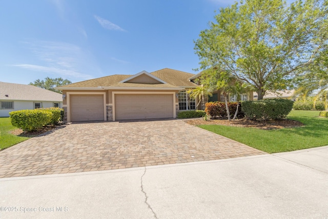 2842 Galindo Cir, Melbourne, FL 32940 - single story home with stucco siding, stone siding, decorative driveway, a front lawn, and a garage