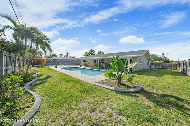 1117 Cheyenne Dr, Indian Harbour Beach, FL 32937 - view of swimming pool with a fenced backyard, a fenced in pool, a patio area, and a lawn