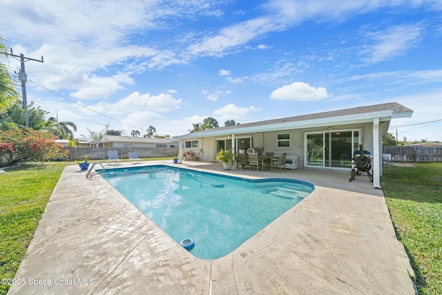 1117 Cheyenne Dr, Indian Harbour Beach, FL 32937 - view of swimming pool featuring a fenced in pool, a fenced backyard, a yard, and a patio area