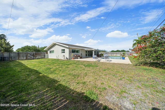 1117 Cheyenne Dr, Indian Harbour Beach, FL 32937 - view of yard with a fenced backyard, a patio area, and a fenced in pool