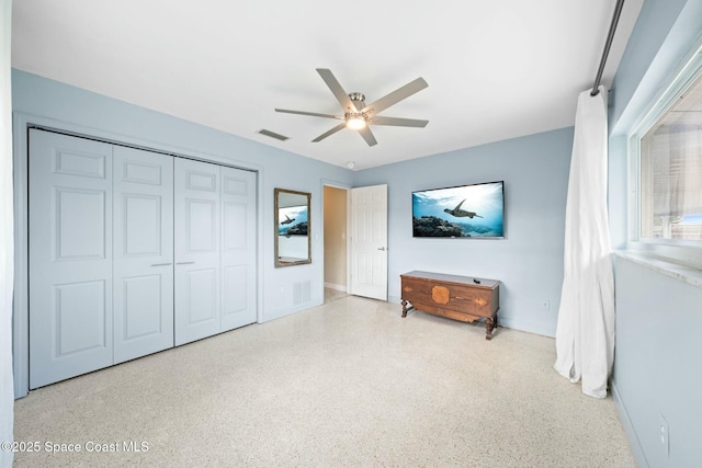 1117 Cheyenne Dr, Indian Harbour Beach, FL 32937 - bedroom with a closet, visible vents, ceiling fan, and speckled floor