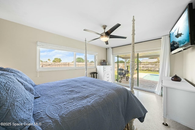 1117 Cheyenne Dr, Indian Harbour Beach, FL 32937 - bedroom featuring access to exterior, speckled floor, and ceiling fan