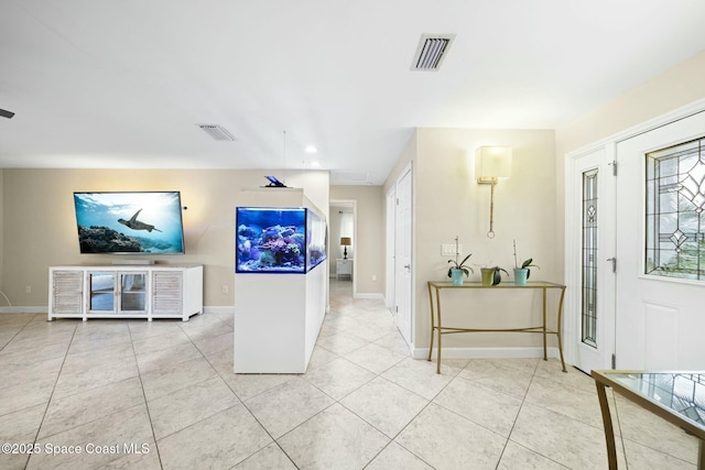 1117 Cheyenne Dr, Indian Harbour Beach, FL 32937 - tiled foyer entrance featuring baseboards and visible vents