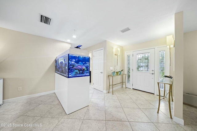 1117 Cheyenne Dr, Indian Harbour Beach, FL 32937 - tiled foyer entrance with baseboards and visible vents