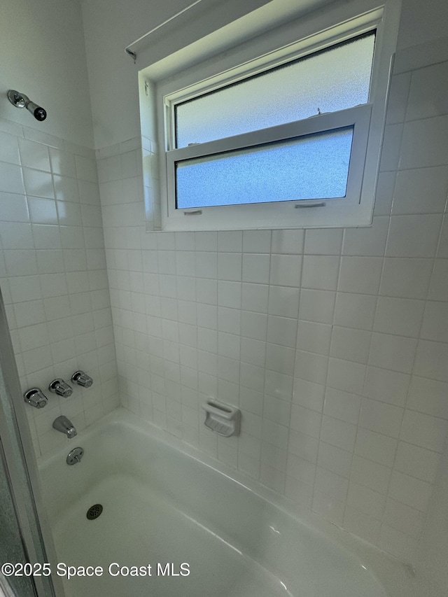 bathroom featuring washtub / shower combination