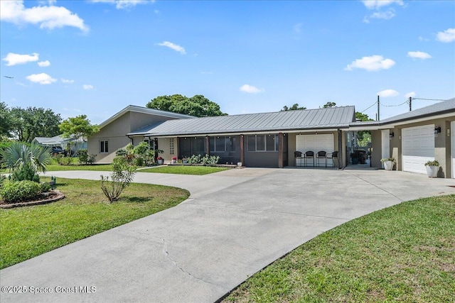 ranch-style house with a front yard, an attached garage, driveway, and stucco siding
