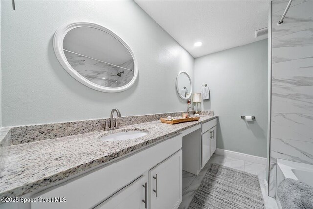 1253 Saint Andrews Dr, Rockledge, FL 32955 - bathroom with double vanity, marble finish floor, a sink, and walk in shower