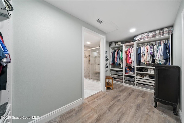 1253 Saint Andrews Dr, Rockledge, FL 32955 - walk in closet with visible vents and wood finished floors