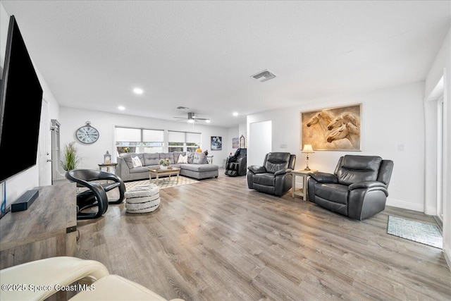 1253 Saint Andrews Dr, Rockledge, FL 32955 - living room featuring baseboards, recessed lighting, visible vents, ceiling fan, and wood finished floors