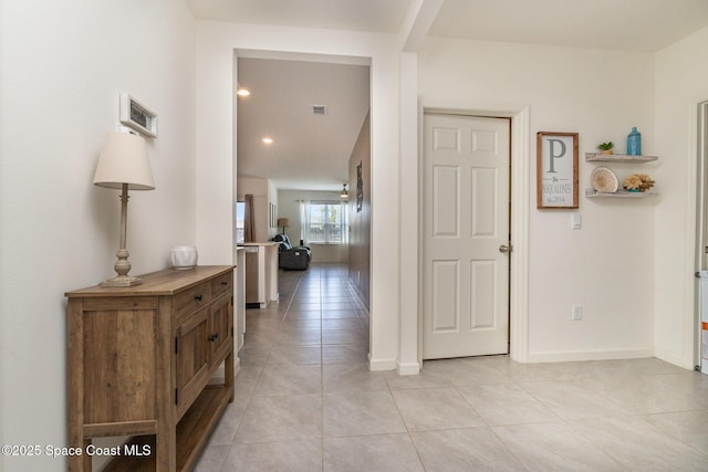 6575 Topaz Dr, Grant, FL 32949 - hall featuring light tile patterned floors, baseboards, and visible vents