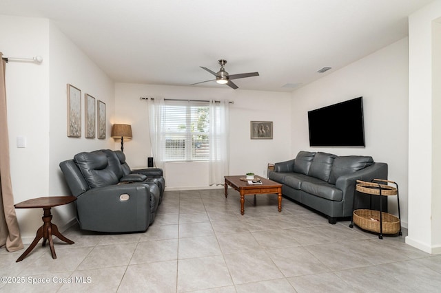 6575 Topaz Dr, Grant, FL 32949 - living area with light tile patterned floors, baseboards, and a ceiling fan