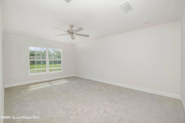 1099 Hanson Ave SW, Palm Bay, FL 32908 - empty room with carpet floors, baseboards, visible vents, and ceiling fan