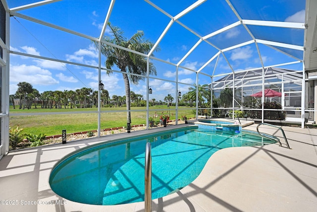 view of pool with a patio, a pool with connected hot tub, glass enclosure, and a lawn