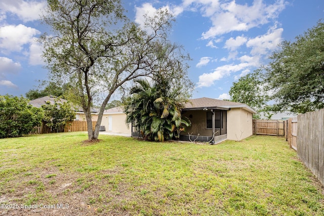 view of yard featuring a fenced backyard