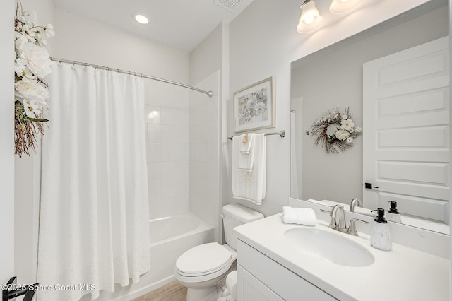bathroom with wood finished floors, vanity, shower / tub combo with curtain, toilet, and recessed lighting
