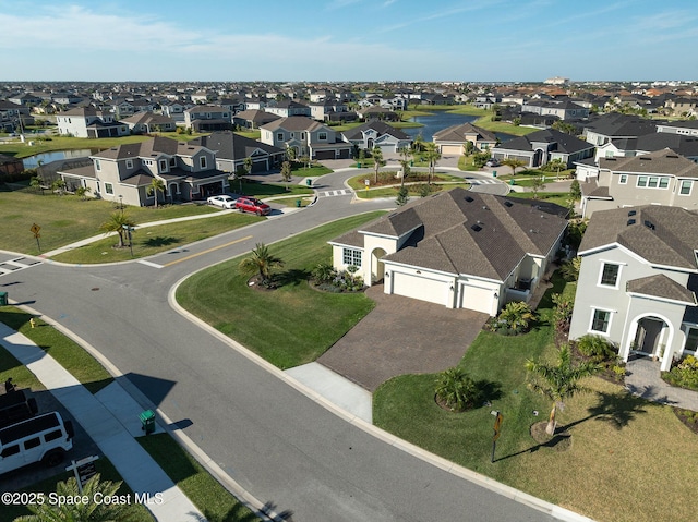 aerial view with a residential view and a water view