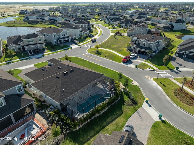 aerial view with a residential view and a water view