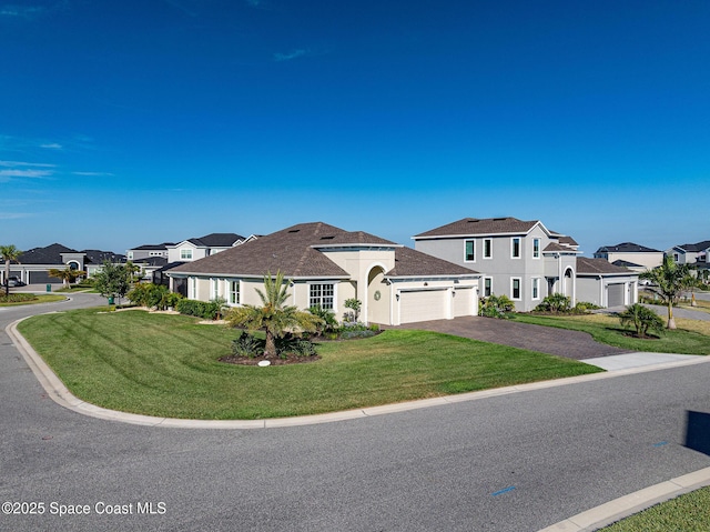 view of front of home featuring a residential view, driveway, an attached garage, a front yard, and stucco siding