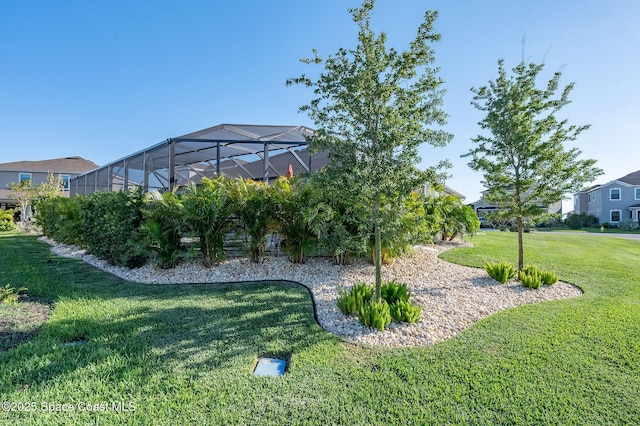 view of yard with a lanai