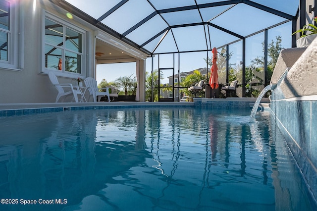outdoor pool featuring a lanai