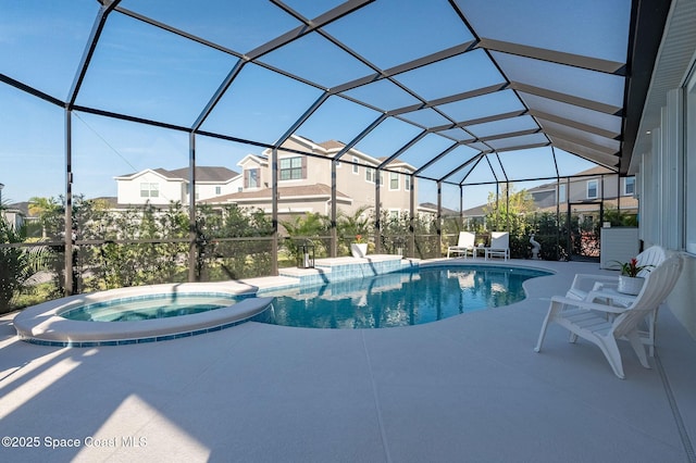 view of swimming pool with glass enclosure, a residential view, a pool with connected hot tub, and a patio