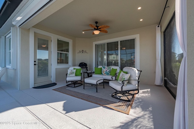 view of patio / terrace featuring ceiling fan