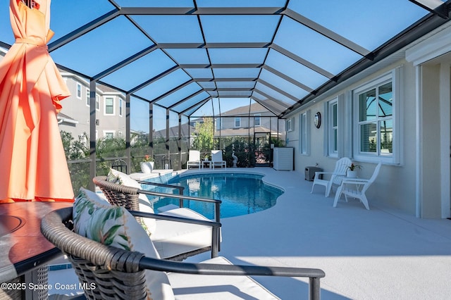 pool featuring a patio area and a lanai