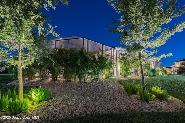 yard at night with a lanai