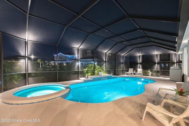 view of pool with a pool with connected hot tub